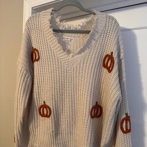 Main Strip Cream V-Neck Sweater with Pumpkin Accents